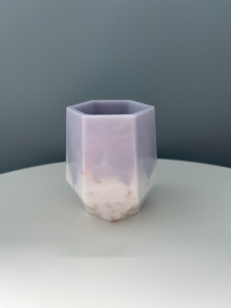 Purple and white resin pot.