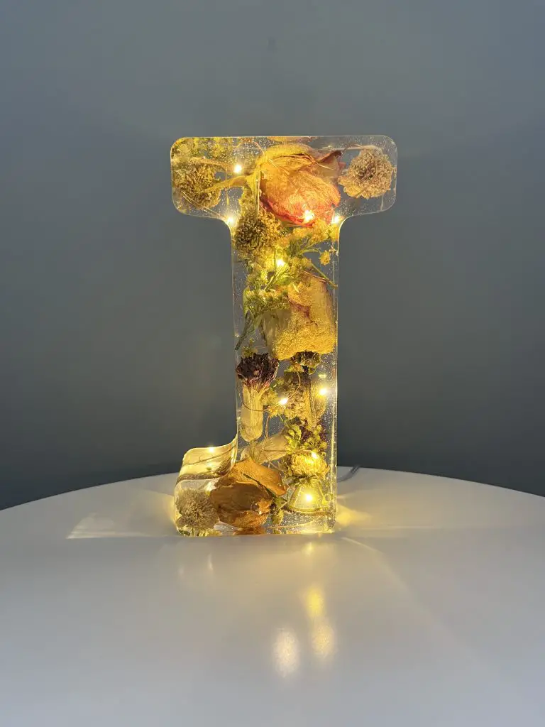 Flower filled resin letter J